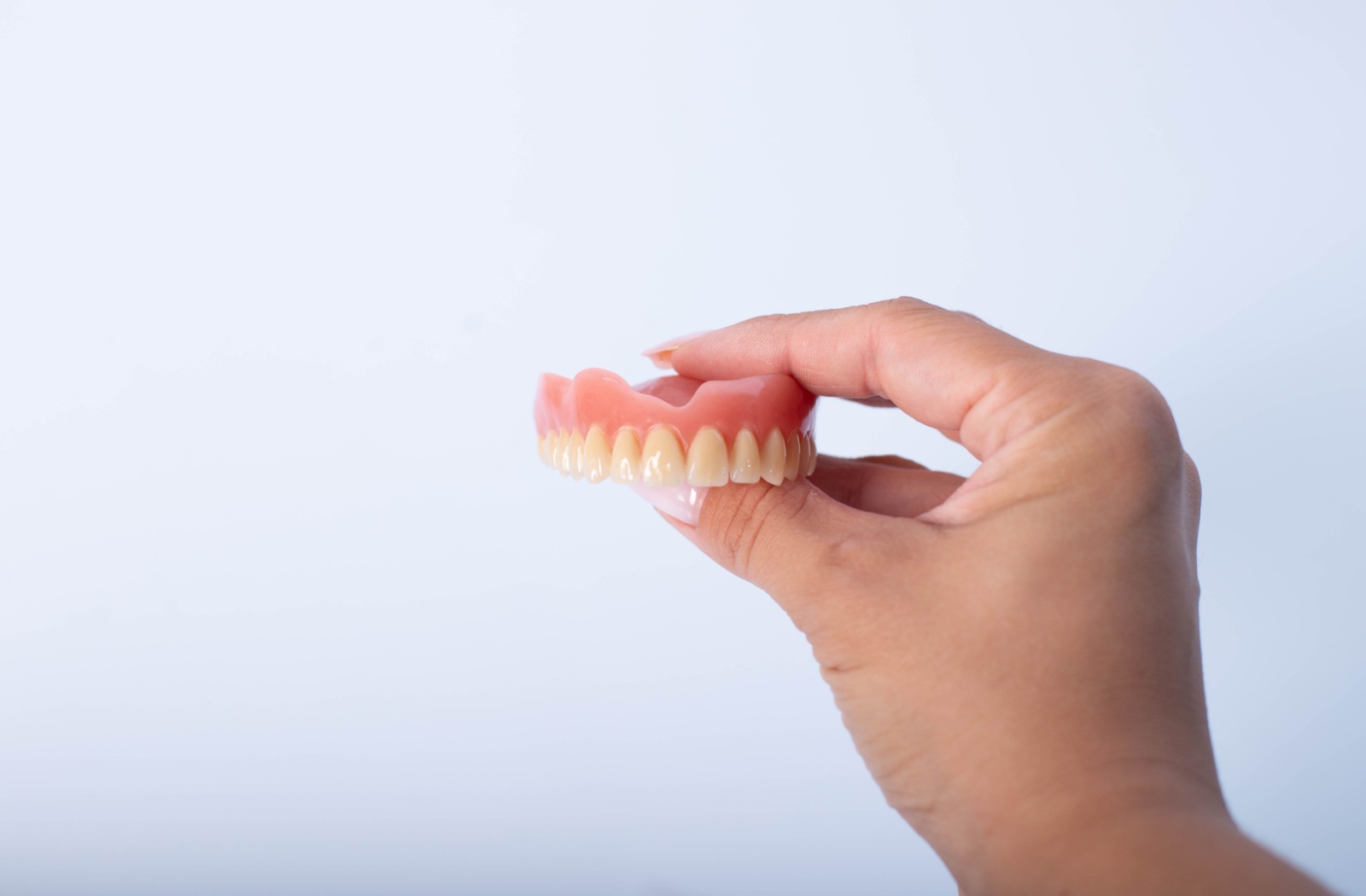 A complete set of dentures displayed against a plain white background.